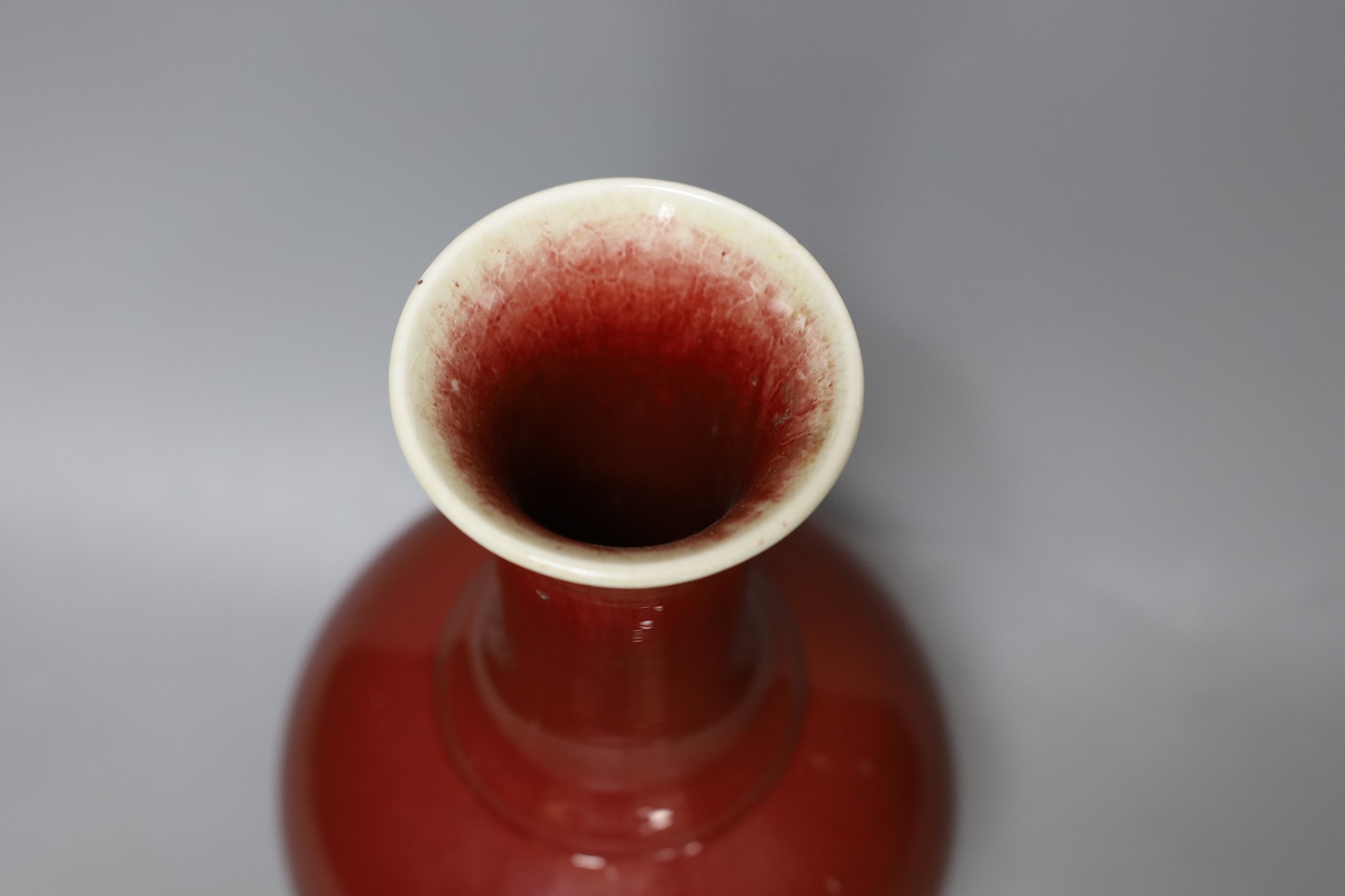 A Chinese ox blood bottle vase, mark to base 27cm